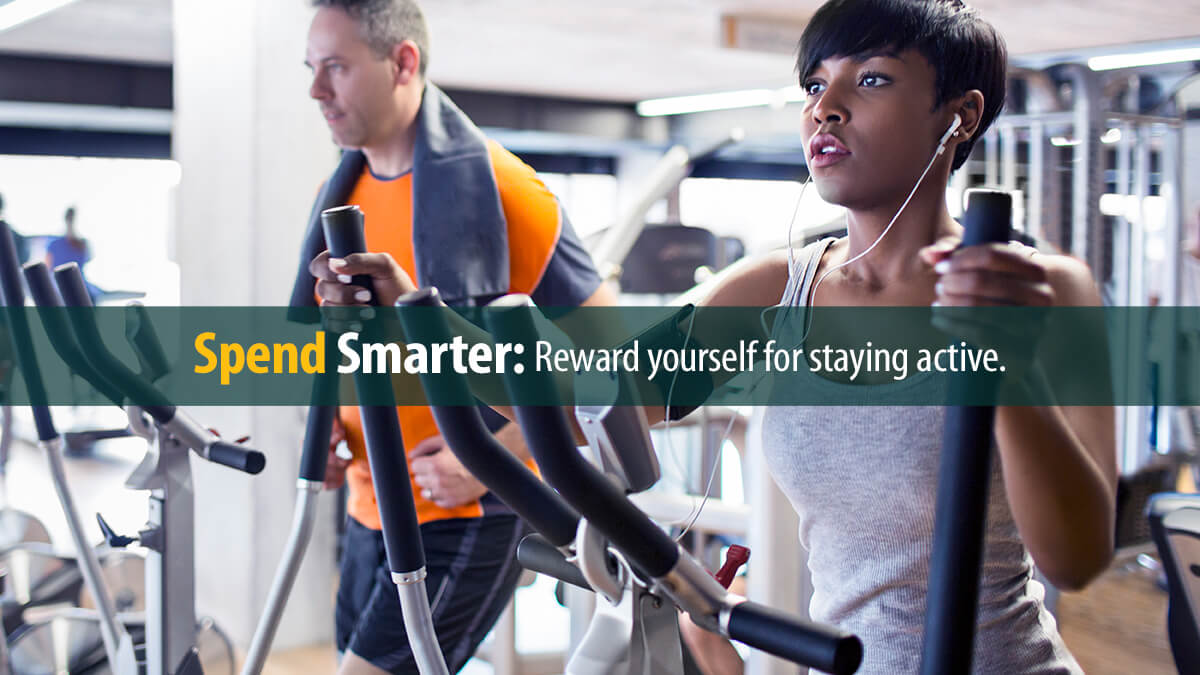 People on the elliptical cross trainer in the gym.